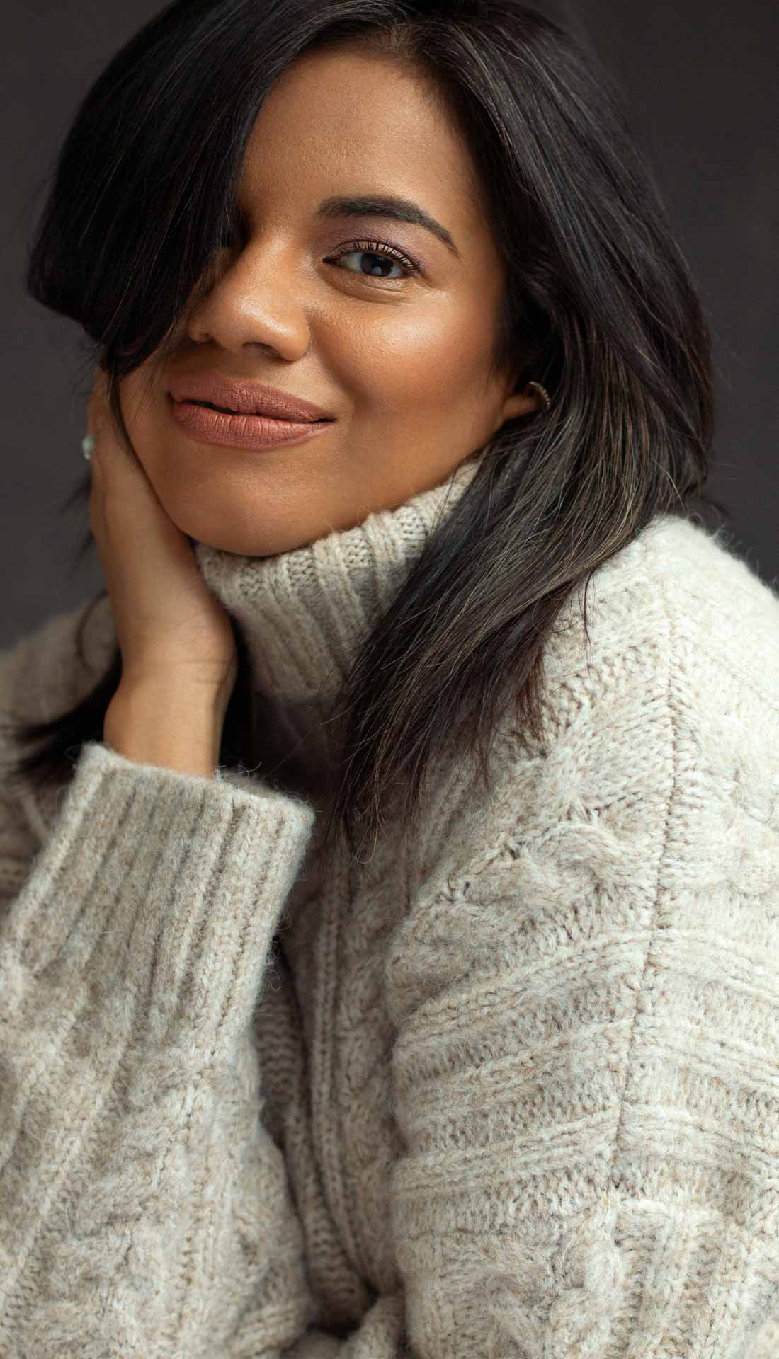 Portrait of a woman in a cozy sweater. Personal photoshoot experience in Birmingham West Midlands