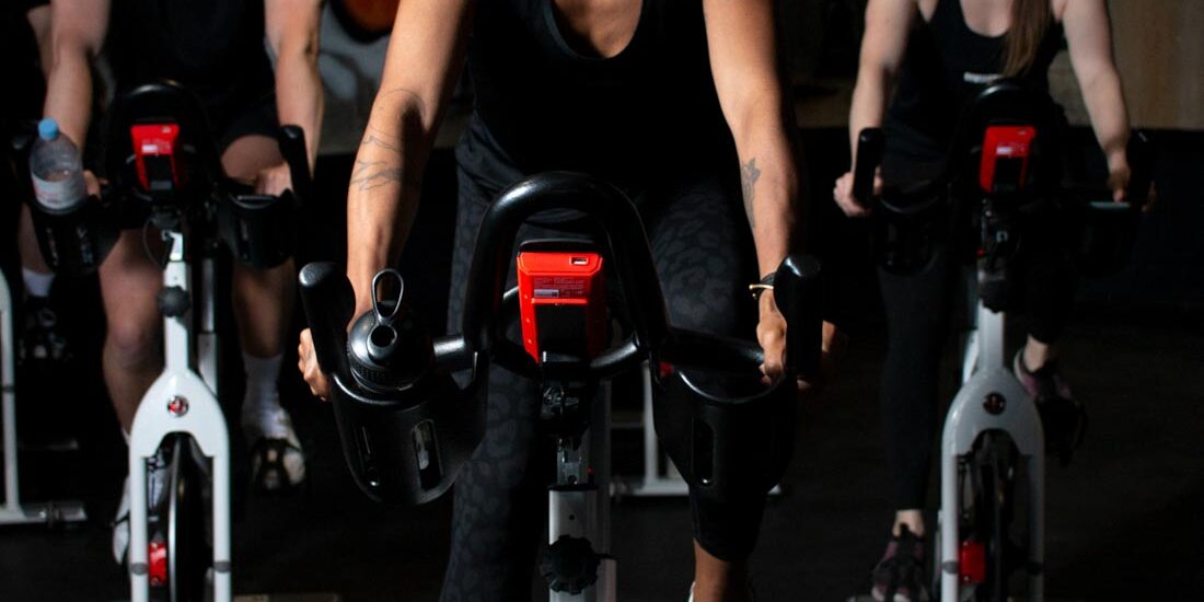 Fitness cycling class. Commercial photography for Birmingham MK Health Hub