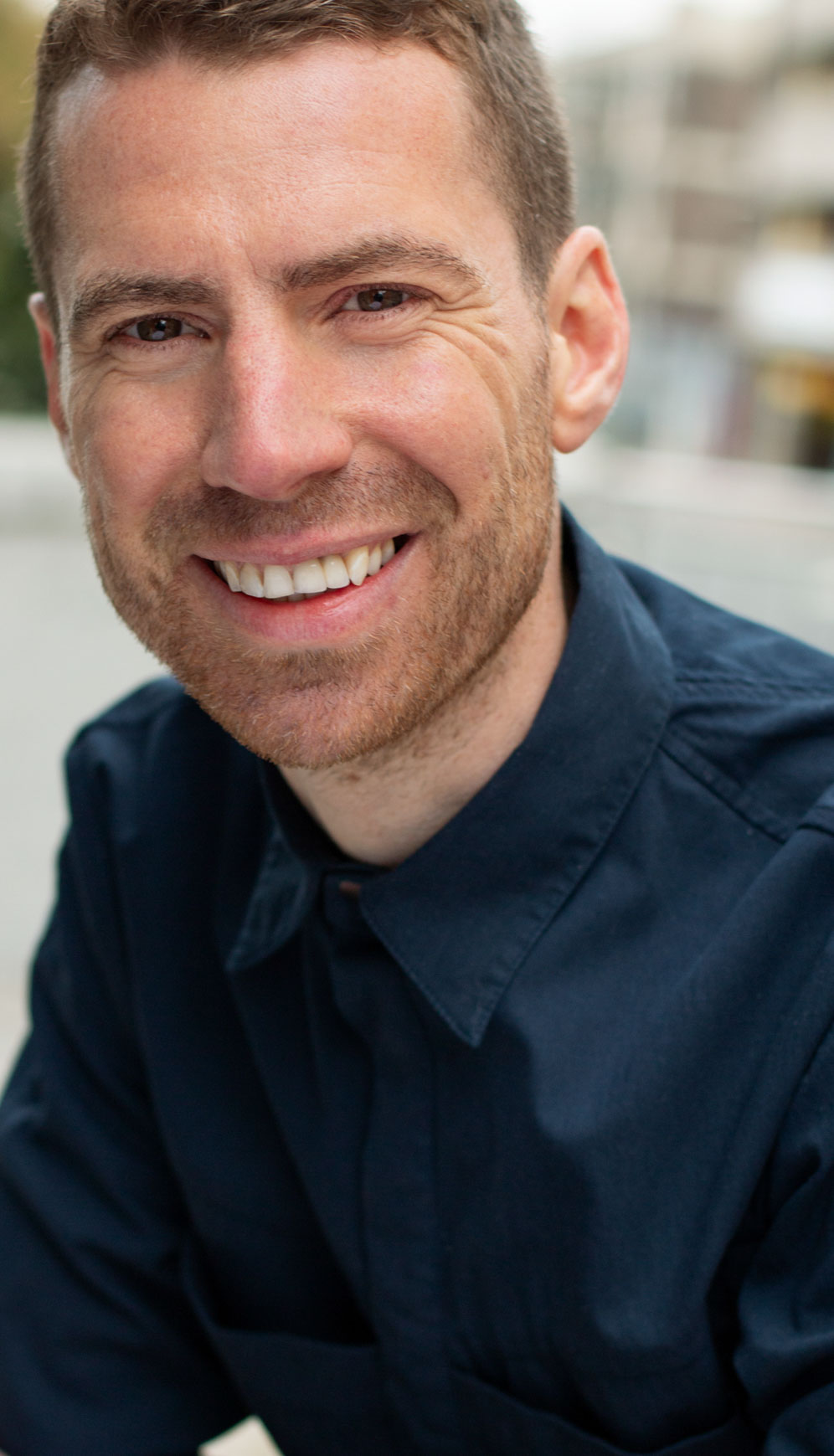 Portrait of a man smiling. Outdoor portrait photoshoot in Birmingham U.K.