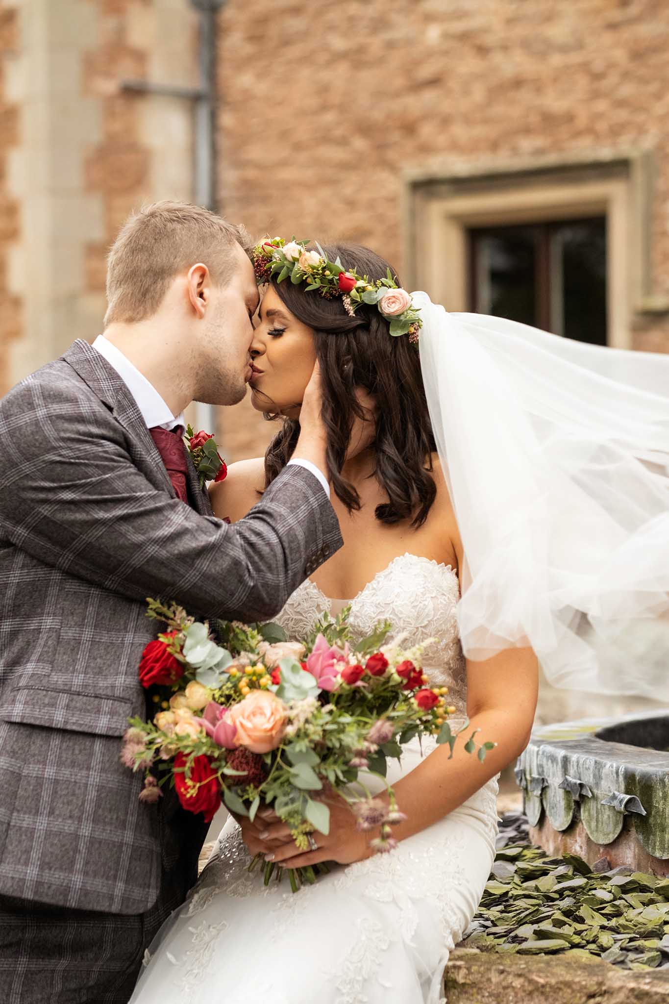 Bride and groom first kiss, Rowton Castle wedding photography