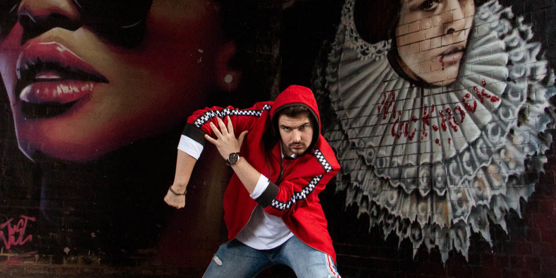 Street dancer striking a pose in front of graffiti wall. Birmingham Digbeth, dance photoshoot