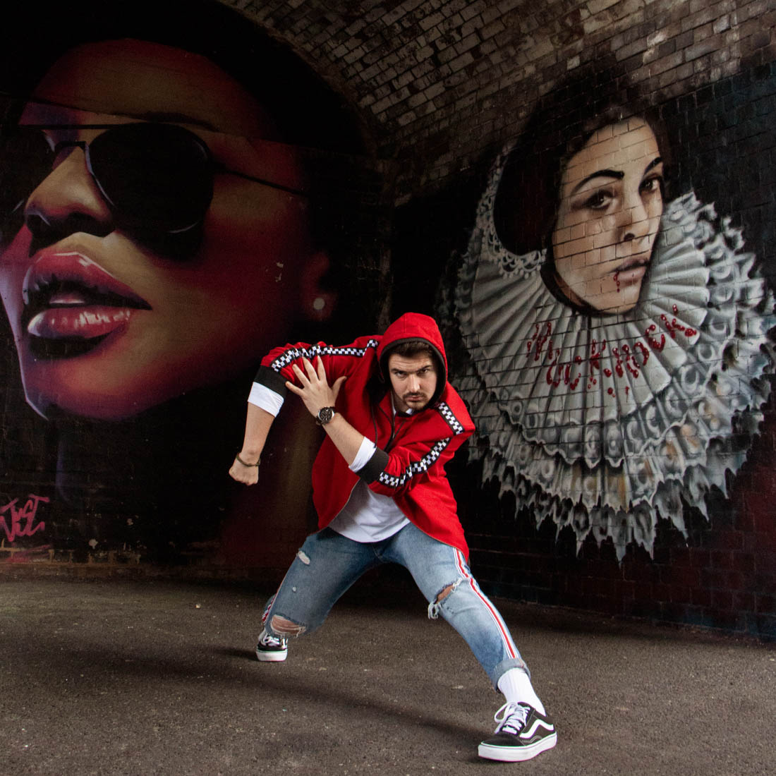 Street dancer striking a pose in front of graffiti wall. Birmingham Digbeth, dance photoshoot