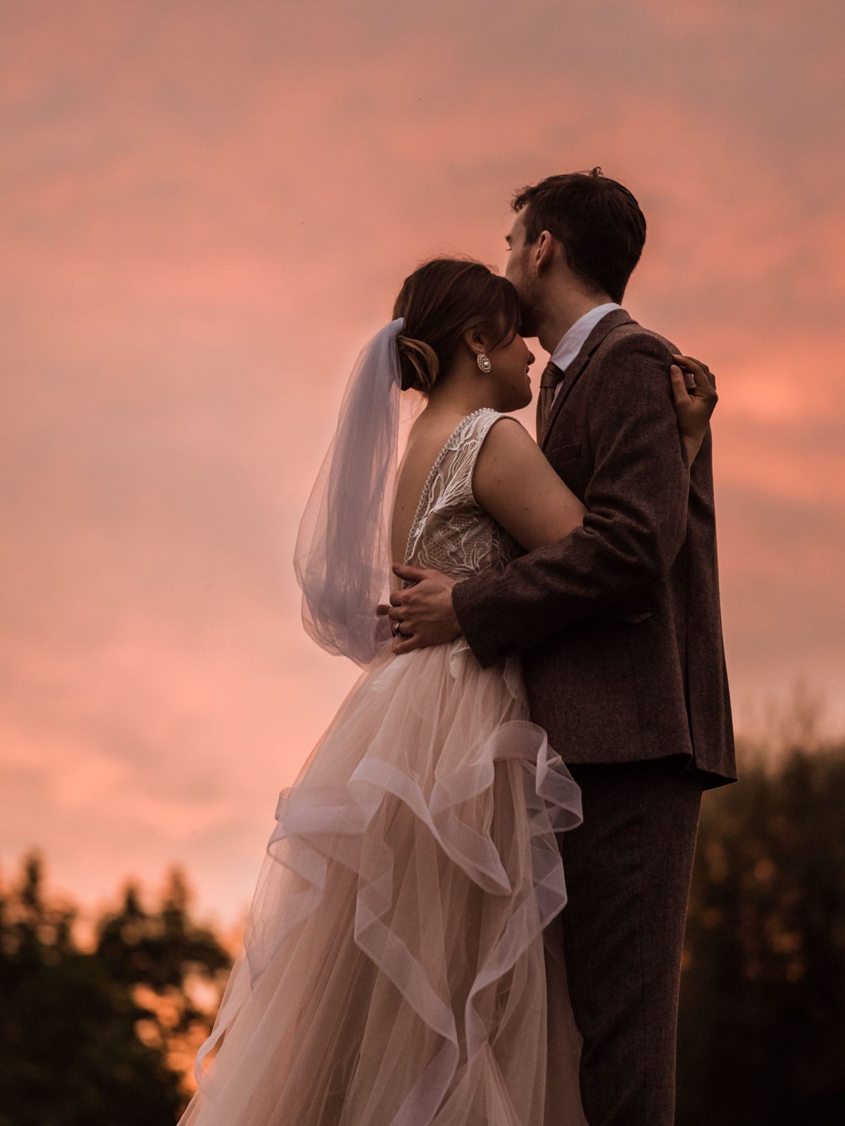 Golden hour photoshoot, sunset wedding photoshoot, bride and groom hugging each other