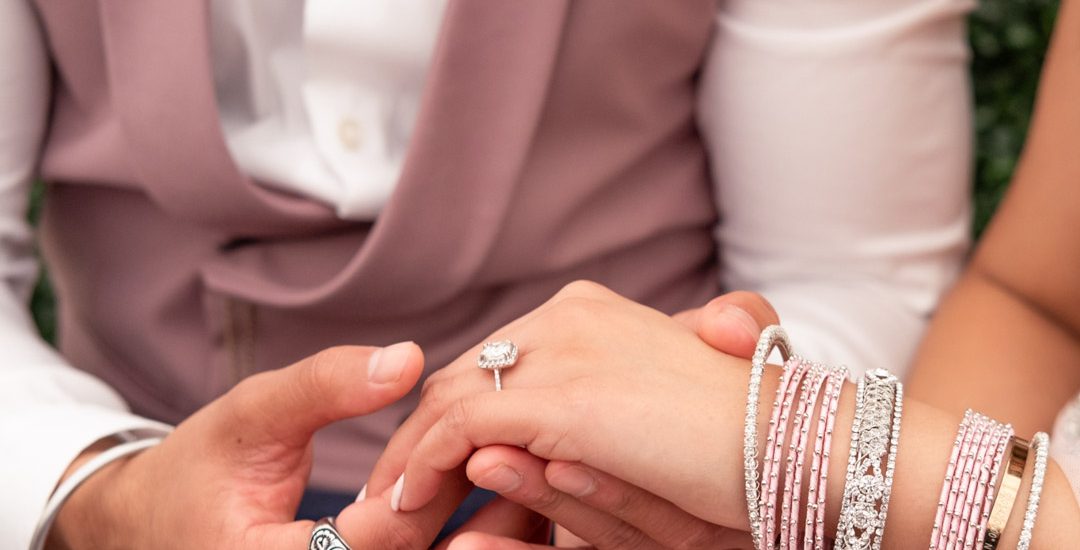 Close up photo of hands during a proposal at a Sikh engagement party