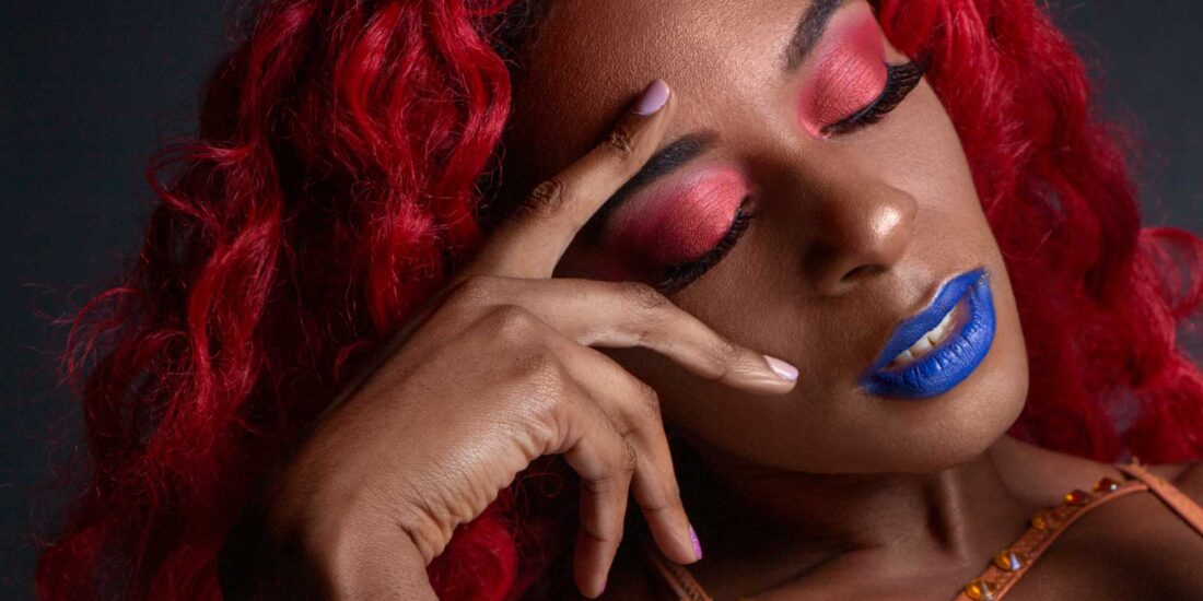 A beauty close up image of a black model with red hair. Beauty and fashion photography in Birmingham UK,