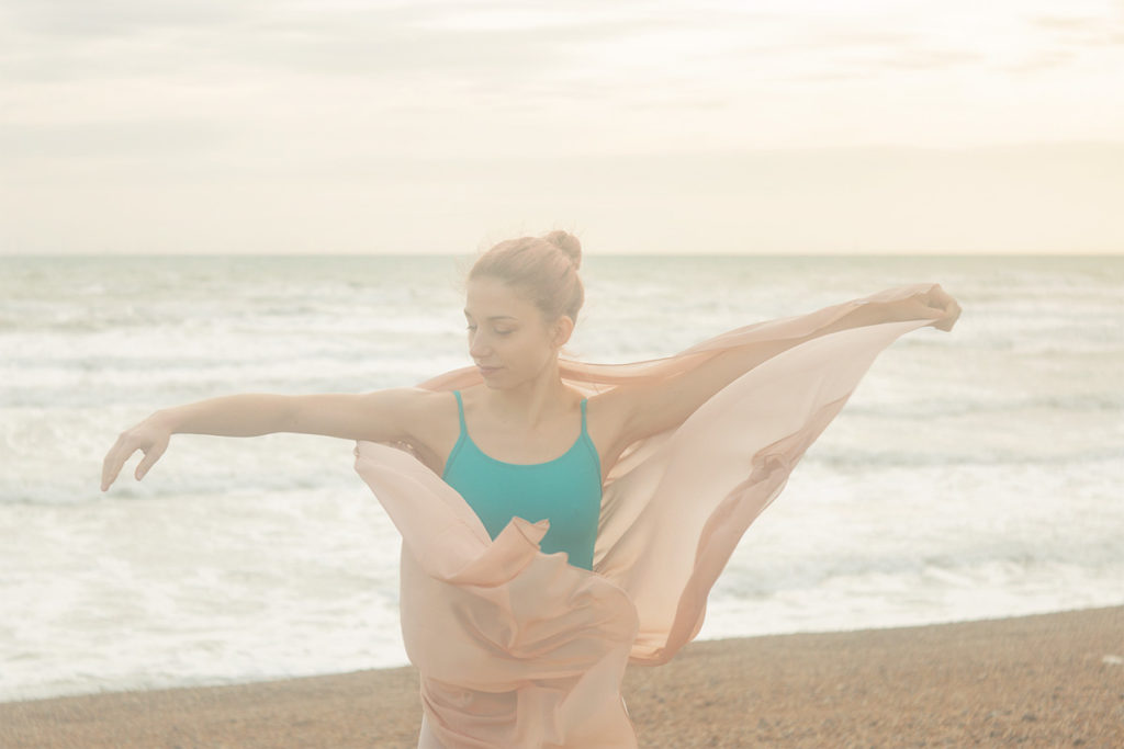 Artistic outdoor ballet photography on the beach uk - ballerina wrapped in scarf - AnastasiaJobson Photography