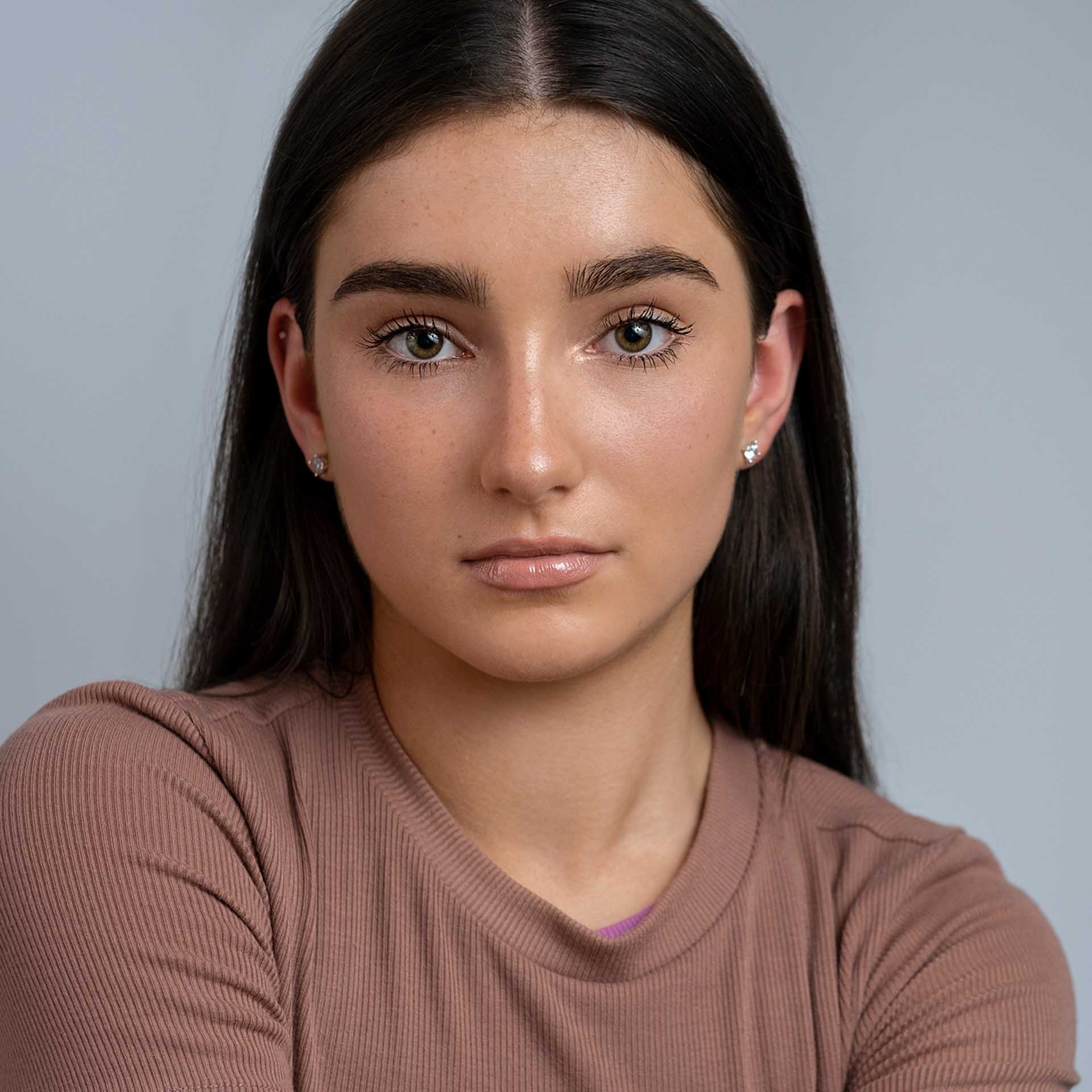 Headshot for acting white background. Professional headshot of a female dancer and actress