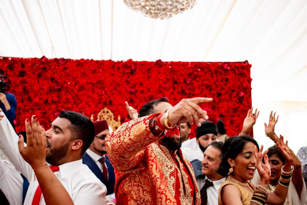 Sikh wedding party. Dance floor full of people dancing and having fun