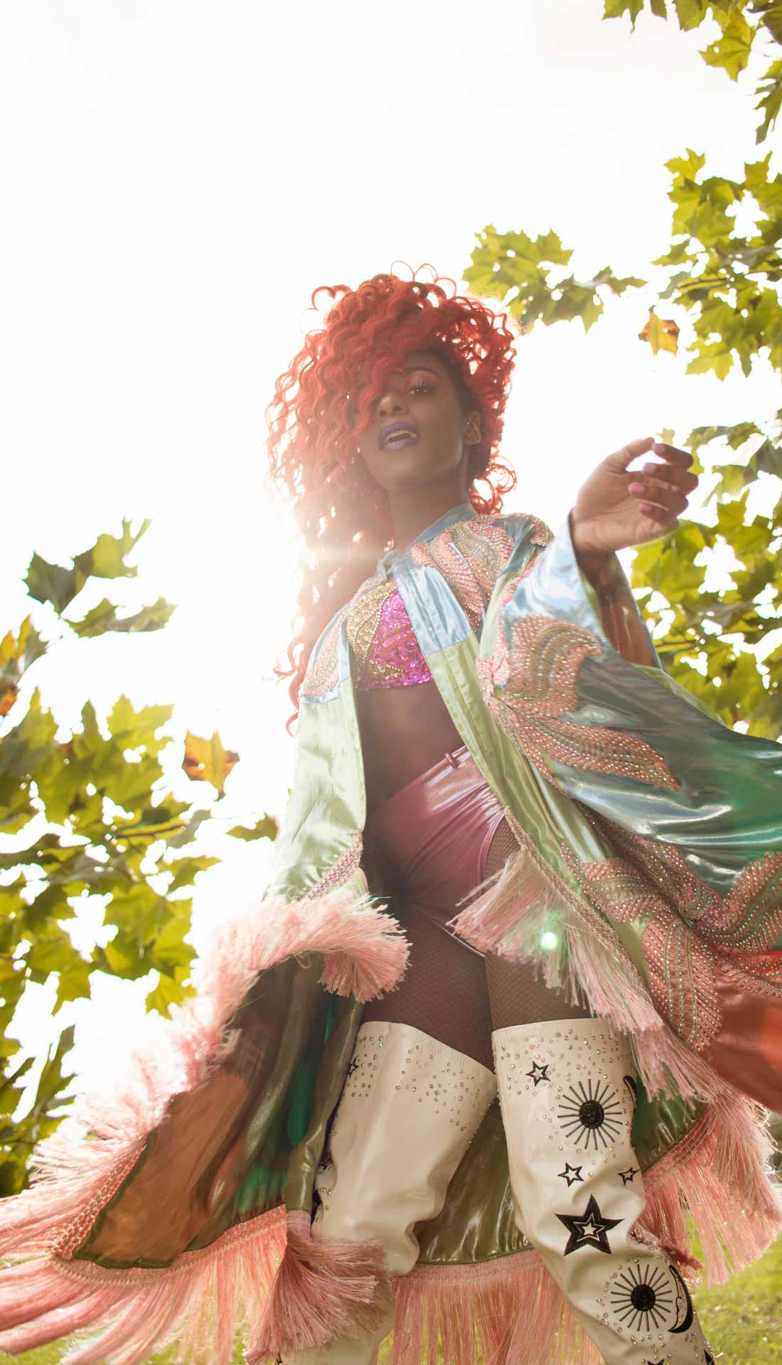 Professional circus performer and dance artist is dancing in the park