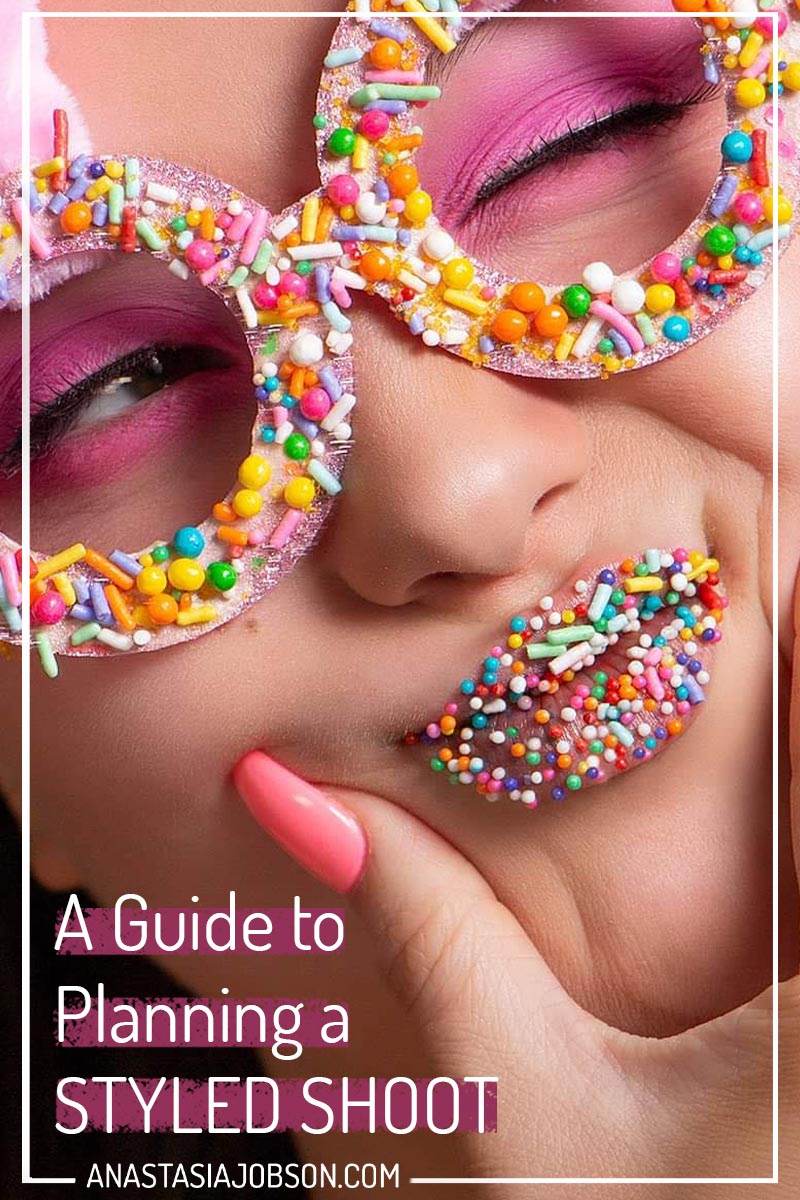 A close up beauty portrait of a young woman with her lips and glasses covered with sprinkles