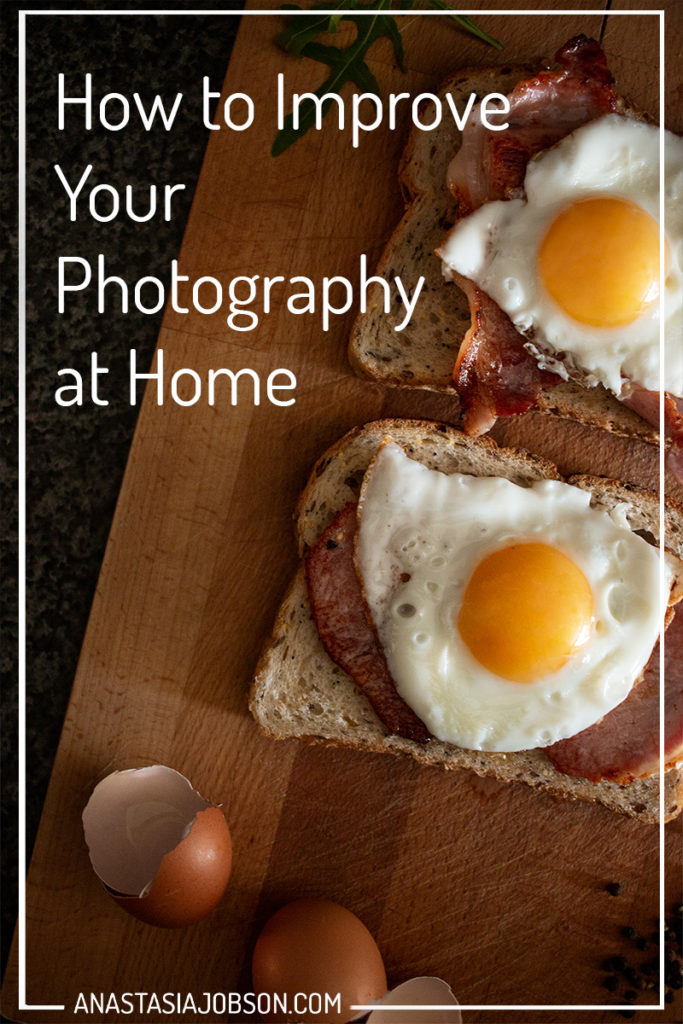Food photography is a great way to improve your photography from home. Egg and bacon sandwiches, egg shells on wooden cutting board