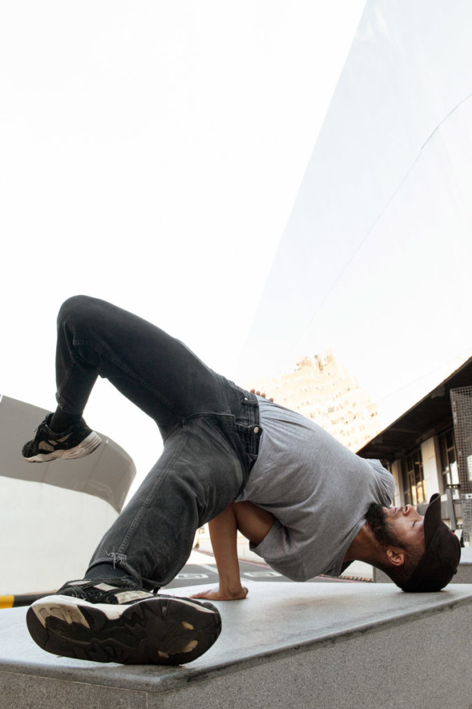 Dancer, Nathan Lafayette, doing an arm-stand. Keep dancing though covid-19 and stay safe