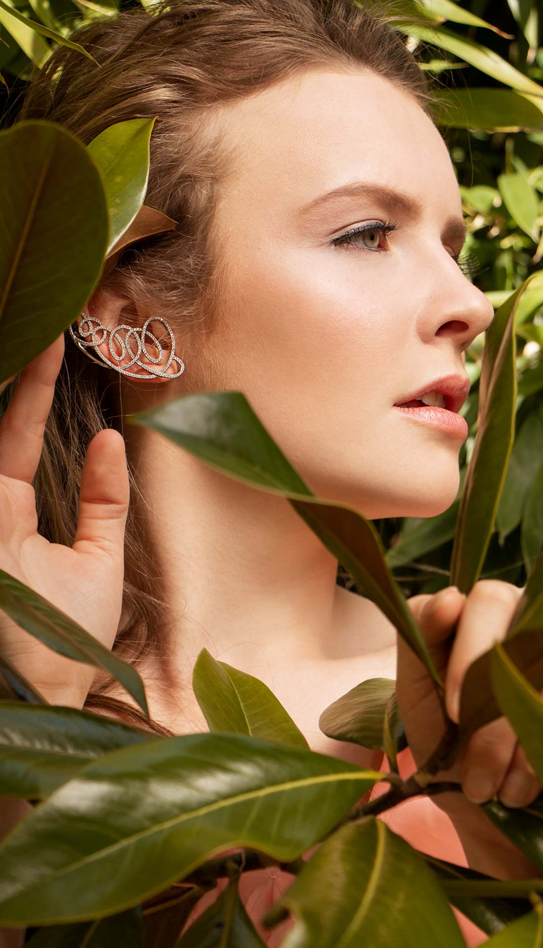 A brunette female model posing in fashion jewellery in a jungle. Jewellery photography Birmingham uk, Commercial photographer Birmingham, jewellery fashion, fashion photographer Birmingham and West Midlands