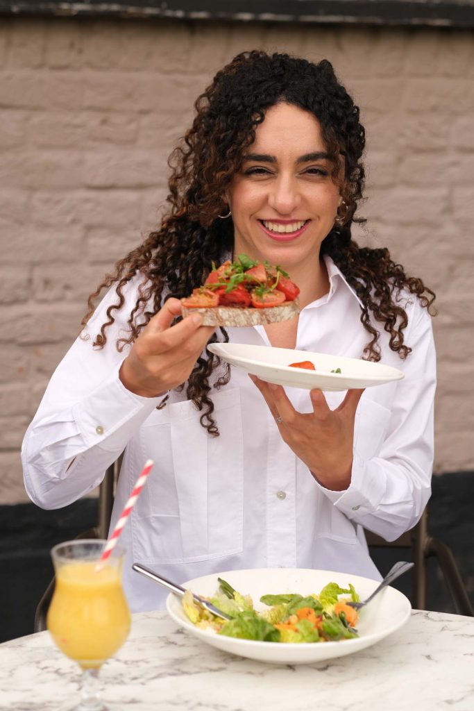 portrait of a nutritionist eating a healthy meal