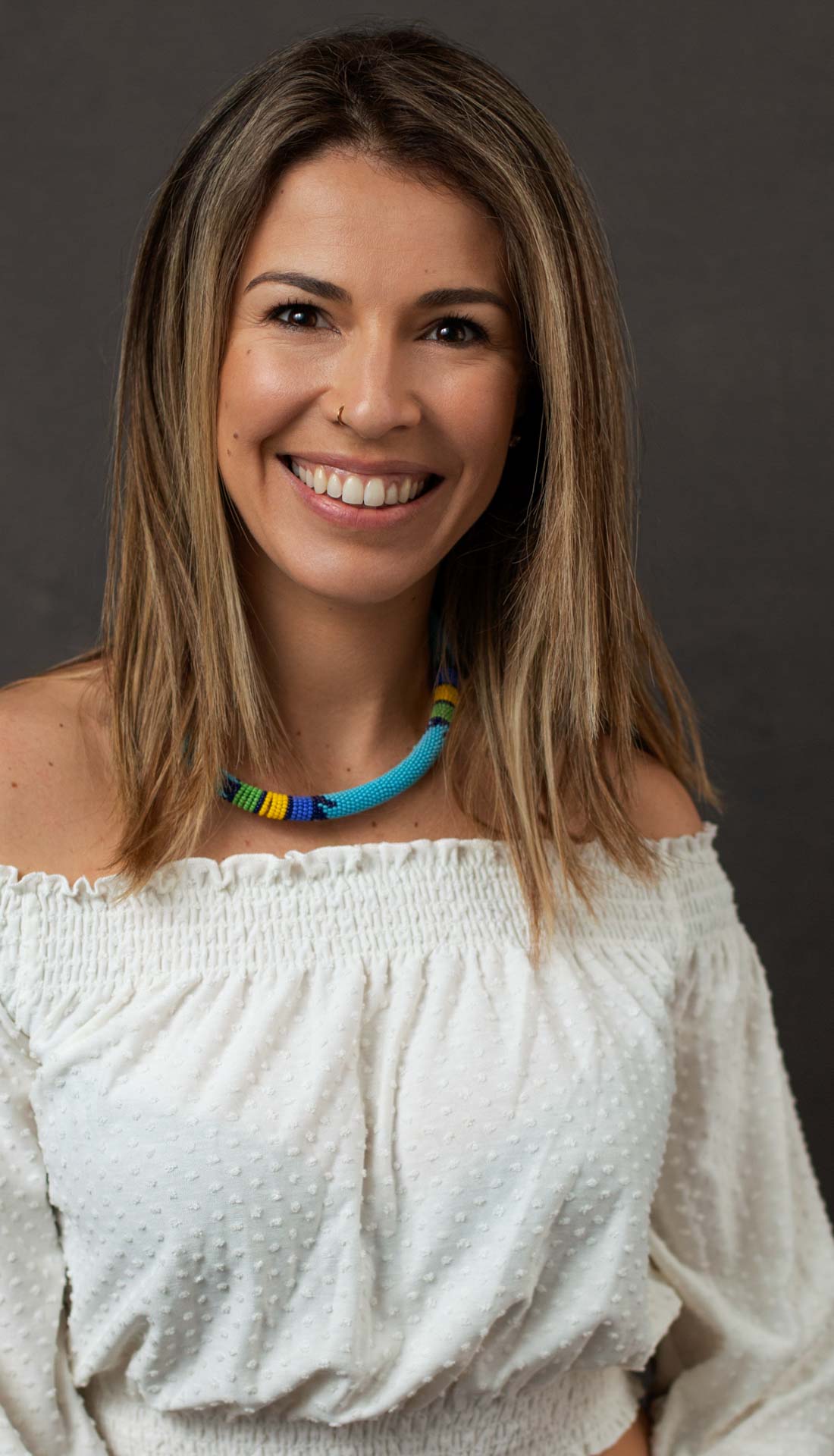 A studio portrait of a book writer Talita Teixeira, professional portrait, modern headshot photography Birmingham