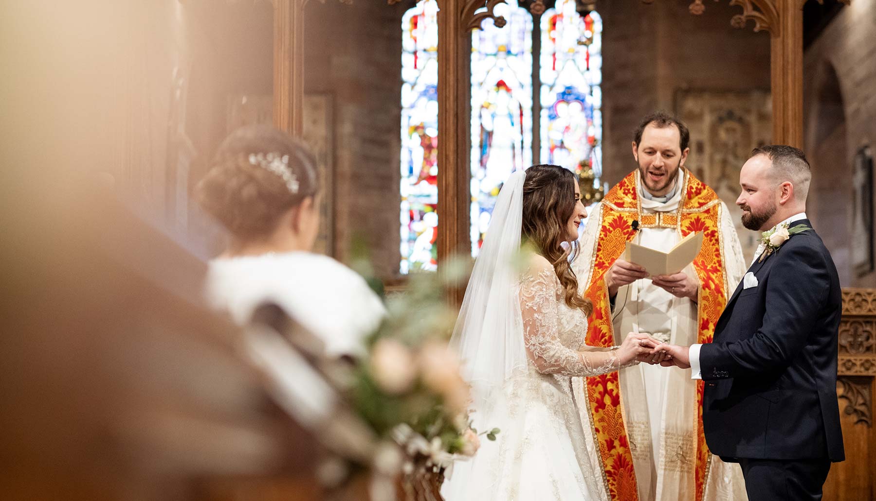 Wedding ring exchange. Church wedding ceremony in Kidderminster, Birmingham.