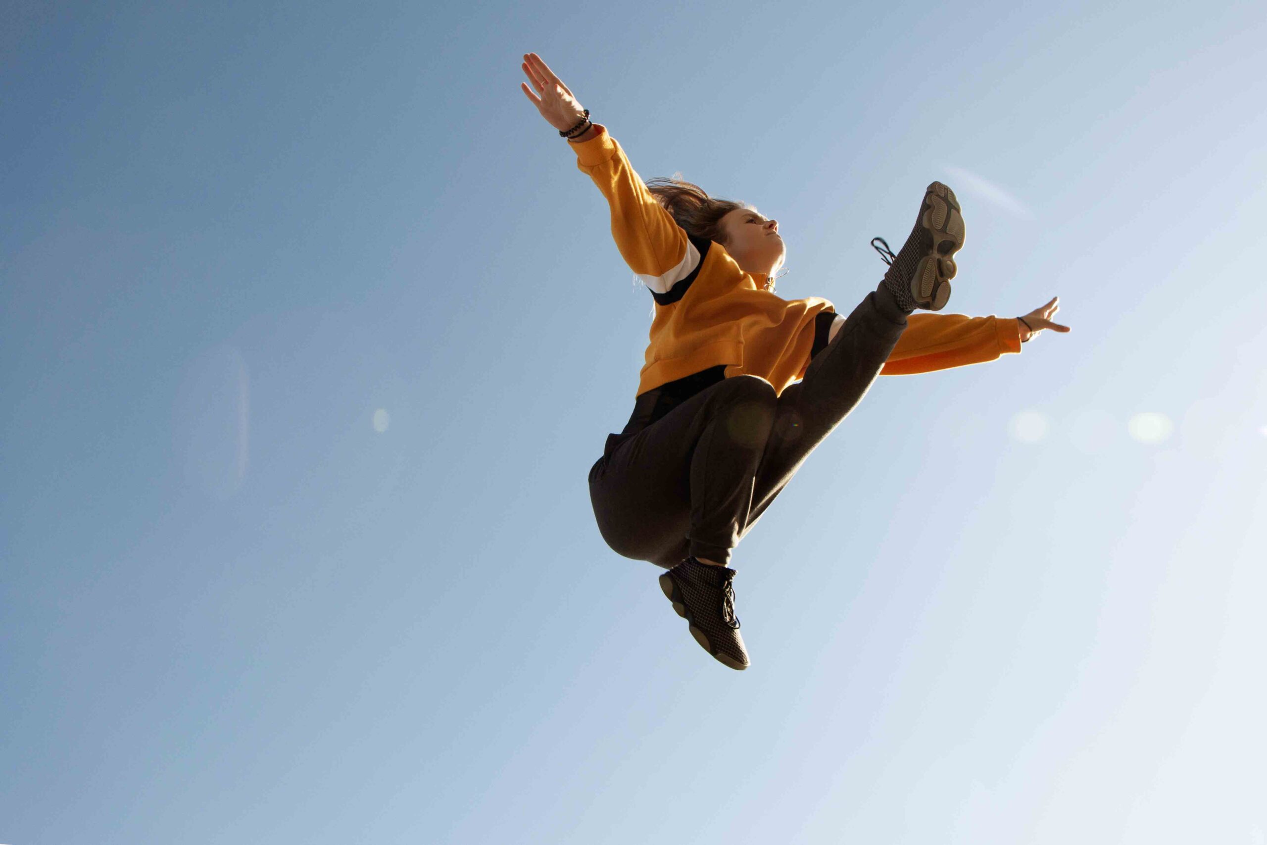 Contemporary dancer doing a dramatic leap. Dance photographer Birmingham U.K. Dance photoshoot in Birmingham city centre