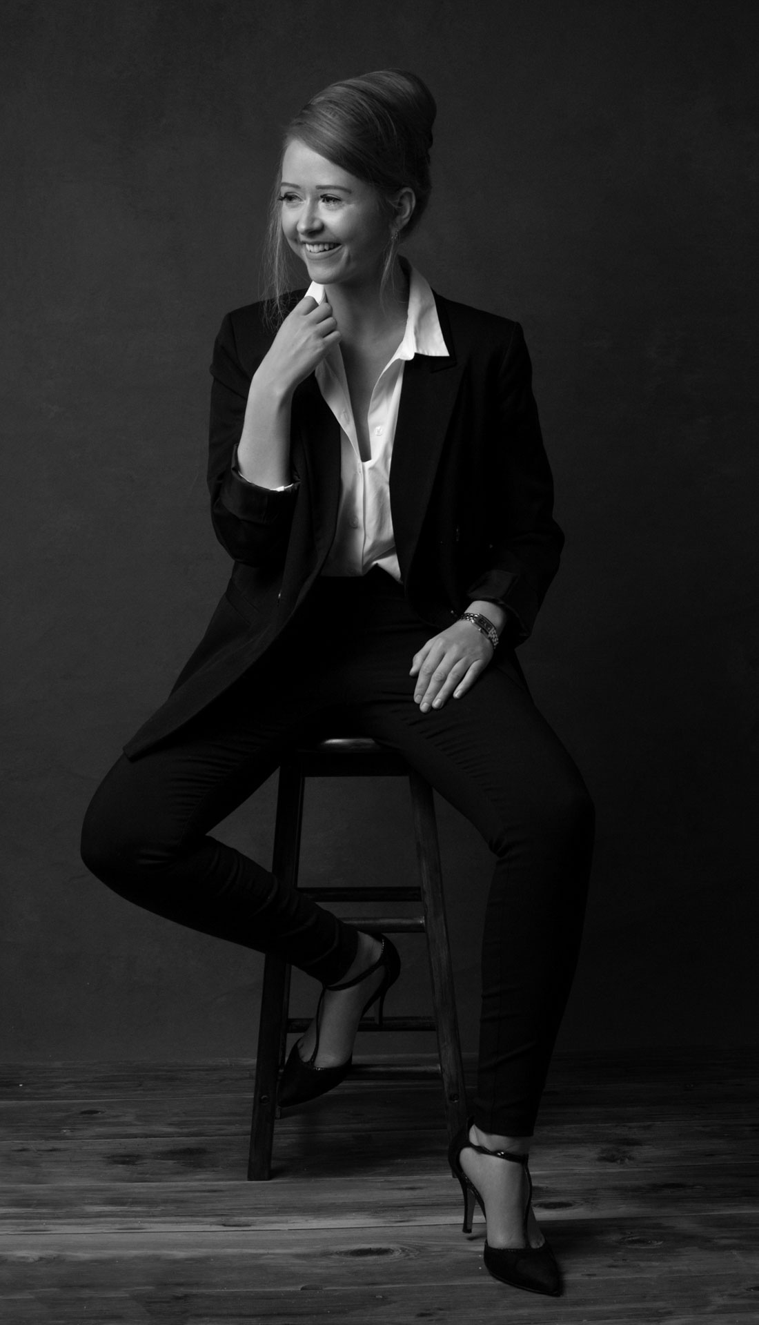 Classic black and white portrait of a blond woman in photography studio. Contemporary portrait photography in Birmingham