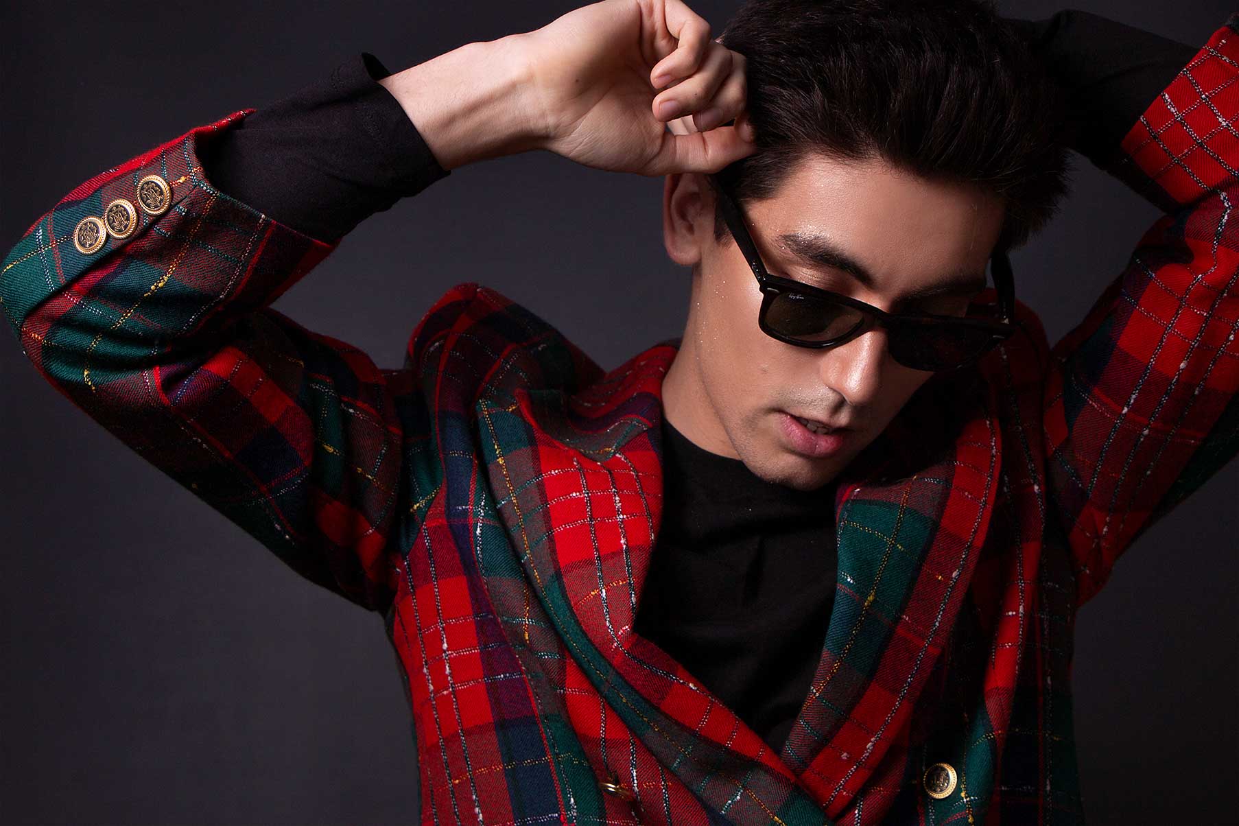 Man posing in a checked suit jacket and Ray-Ban sunglasses. Studio fashion photoshoot, mens fashion, men suit fashion, fashion photographer Birmingham 