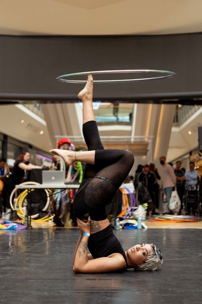 Fierce Flow show at Bullring during Birmingham Weekender 2021, female performer is hula hooping