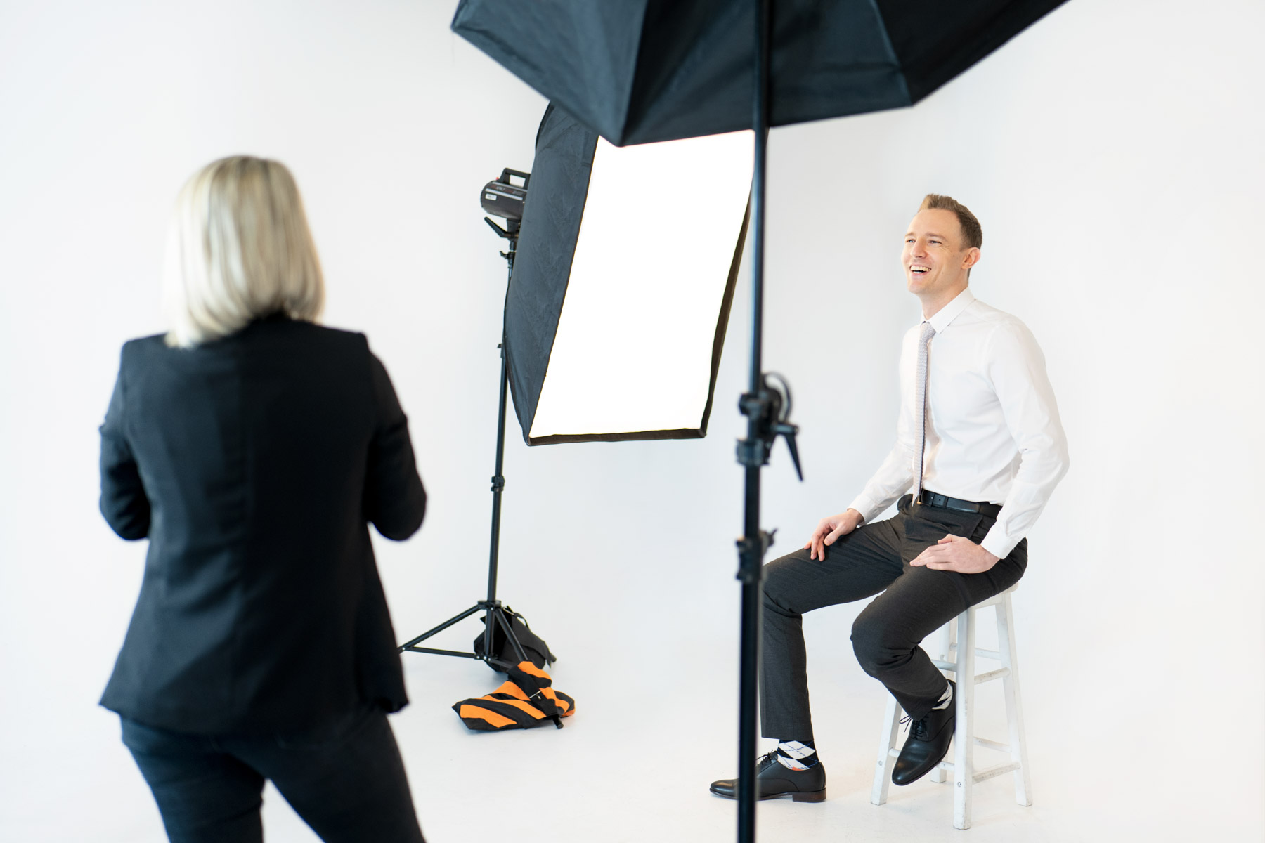 Birmingham corporate headshots backstage image or a man laughing while being photographed