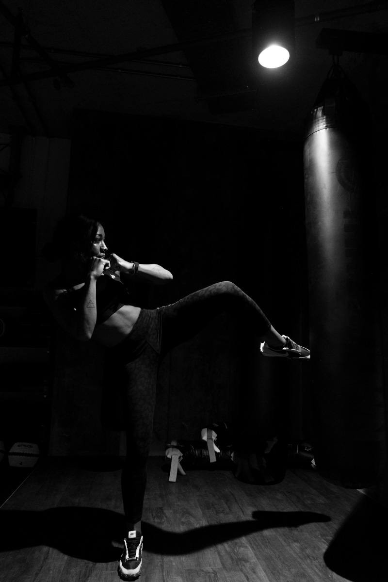 Woman practicing fighting at the gym. MK HealthHub