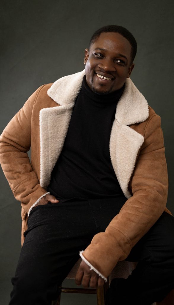 studio portrait of a man smiling