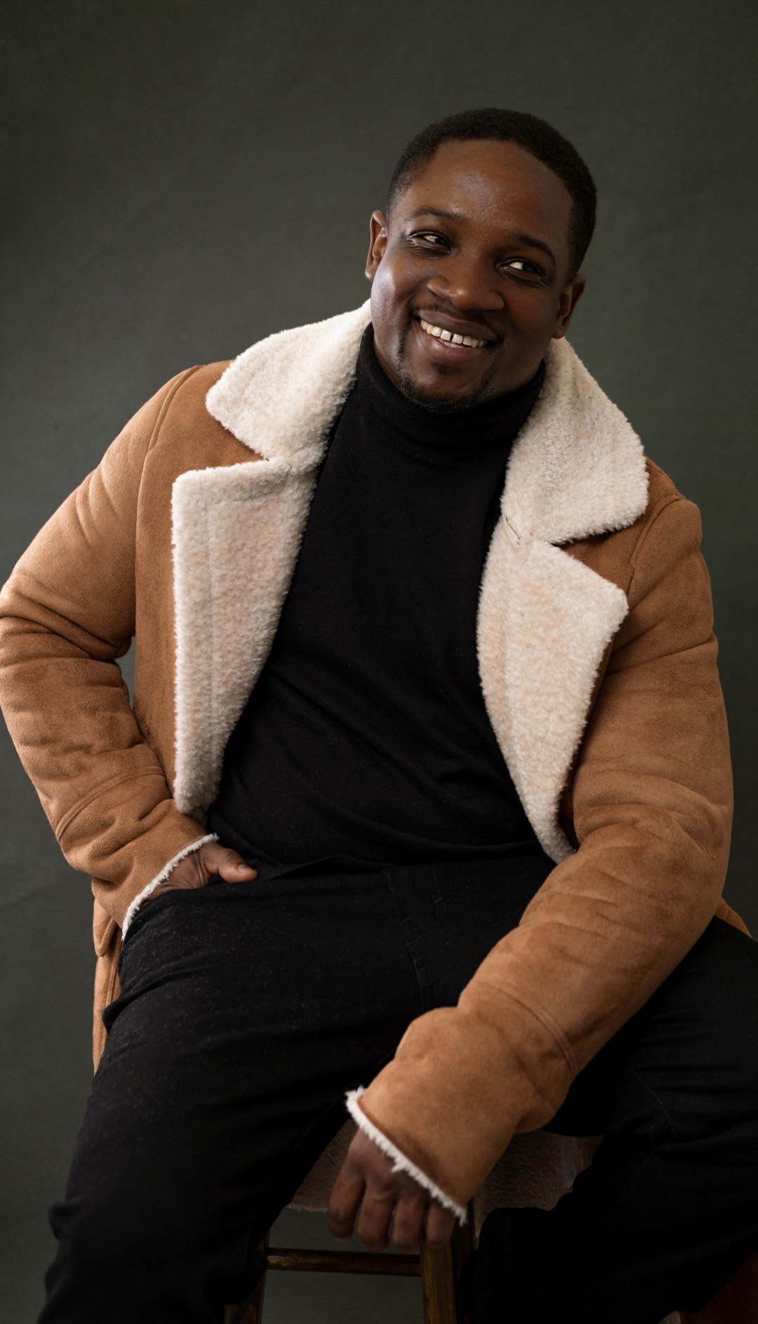 studio portrait of a man smiling