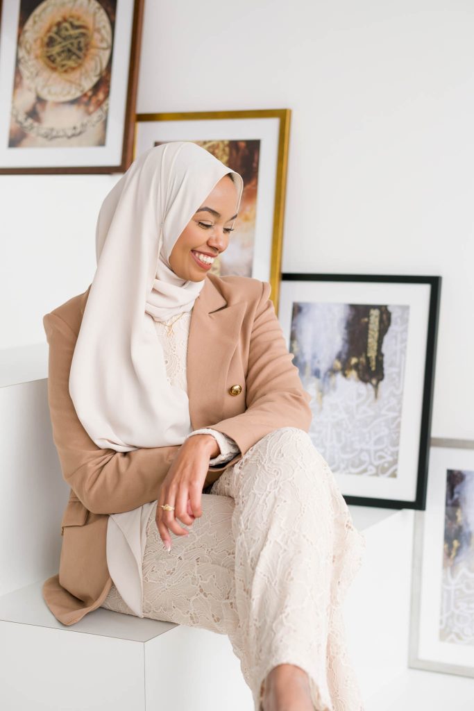 artist brand photography, a female artist looking away laughing