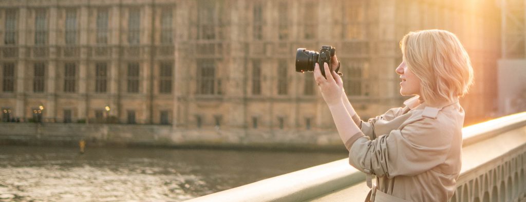 a professional female photographer is taking a photo