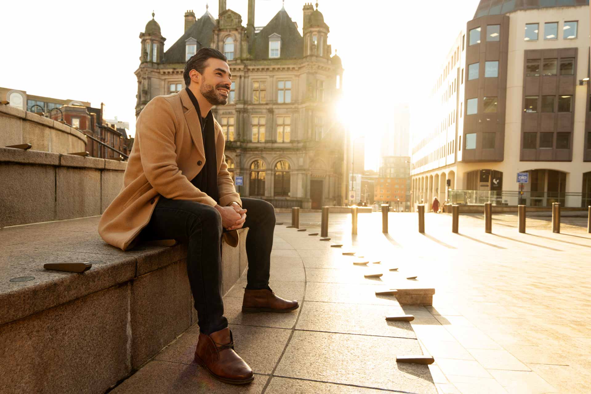 outdoor fashion portrait of a man smiling in Birmingham city centre