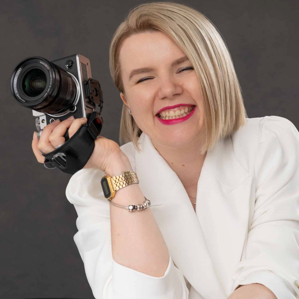 business headshot portrait of a female photographer smiling
