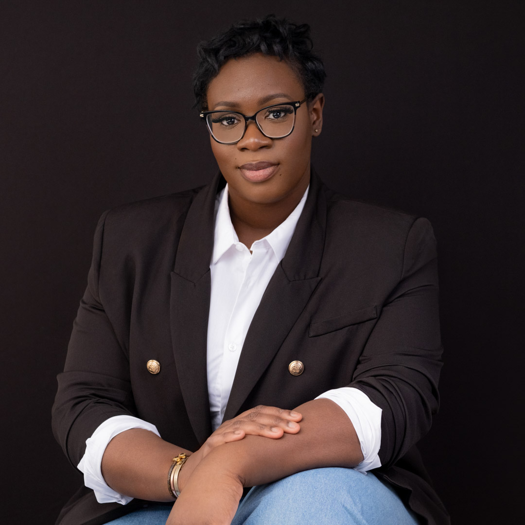 Fashion style business portrait of a woman in glasses black background