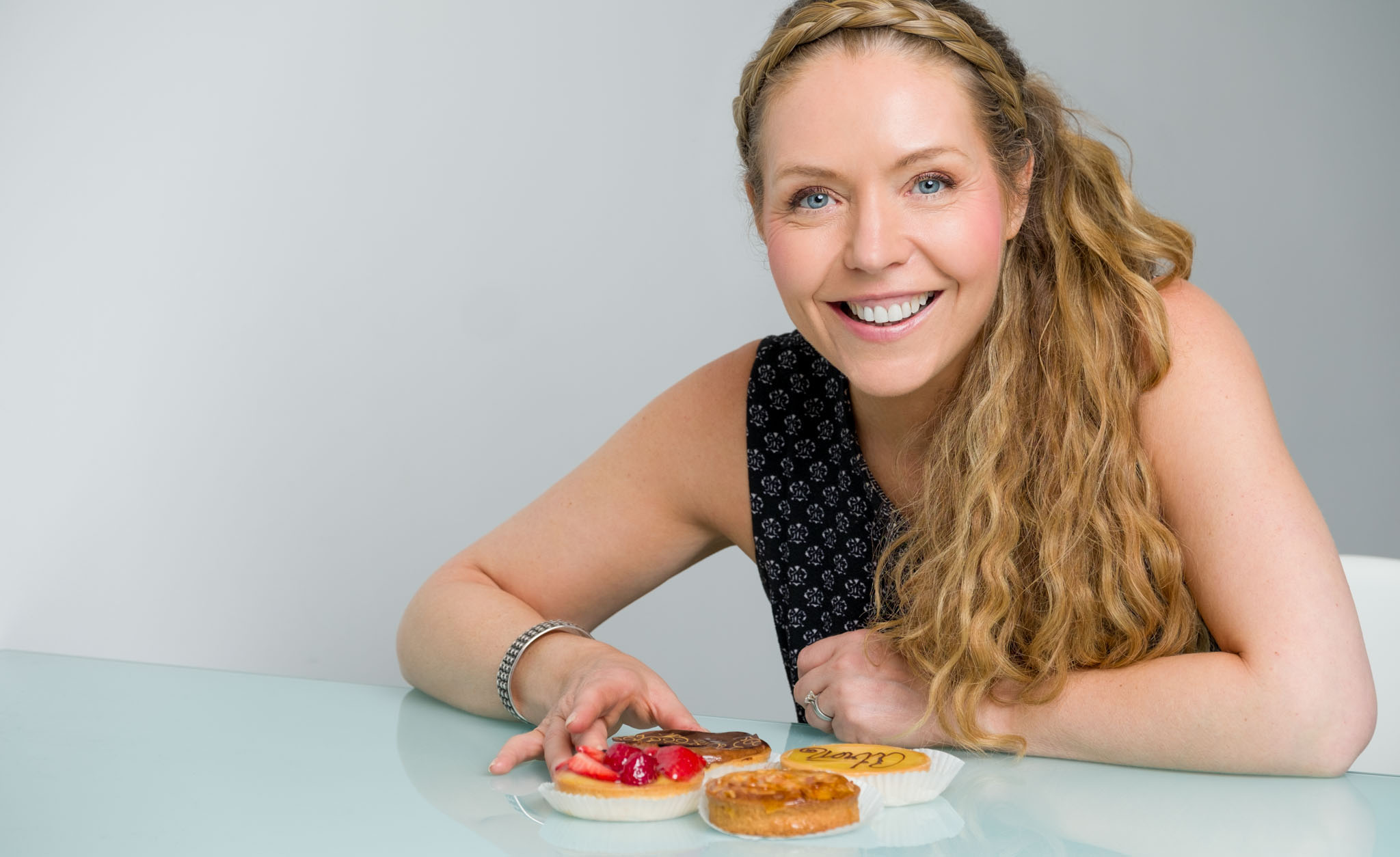 nutritionist branding photography portrait, posing with cakes
