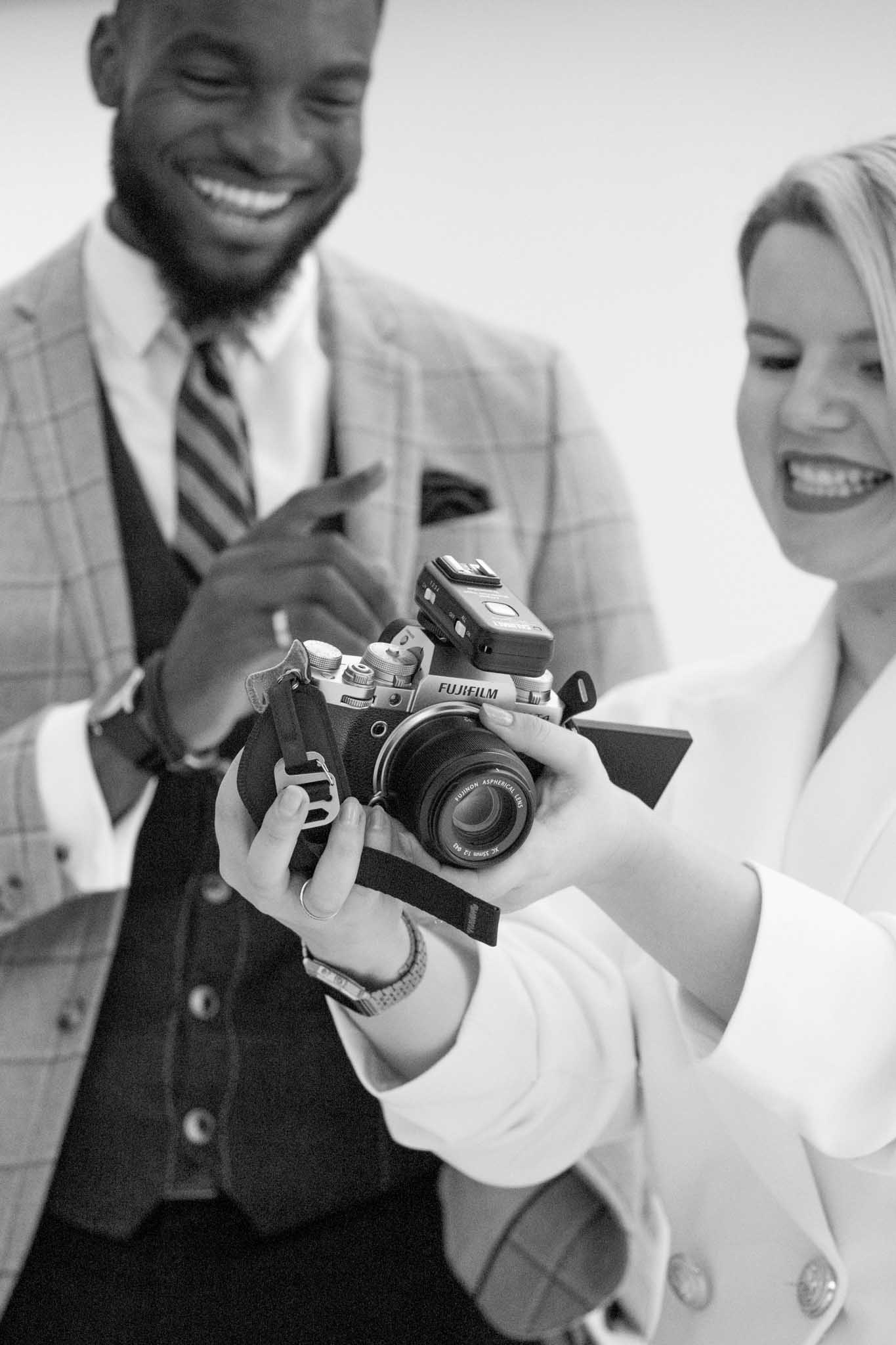 headshot photoshoot backstage reviewing the photos with a photography client