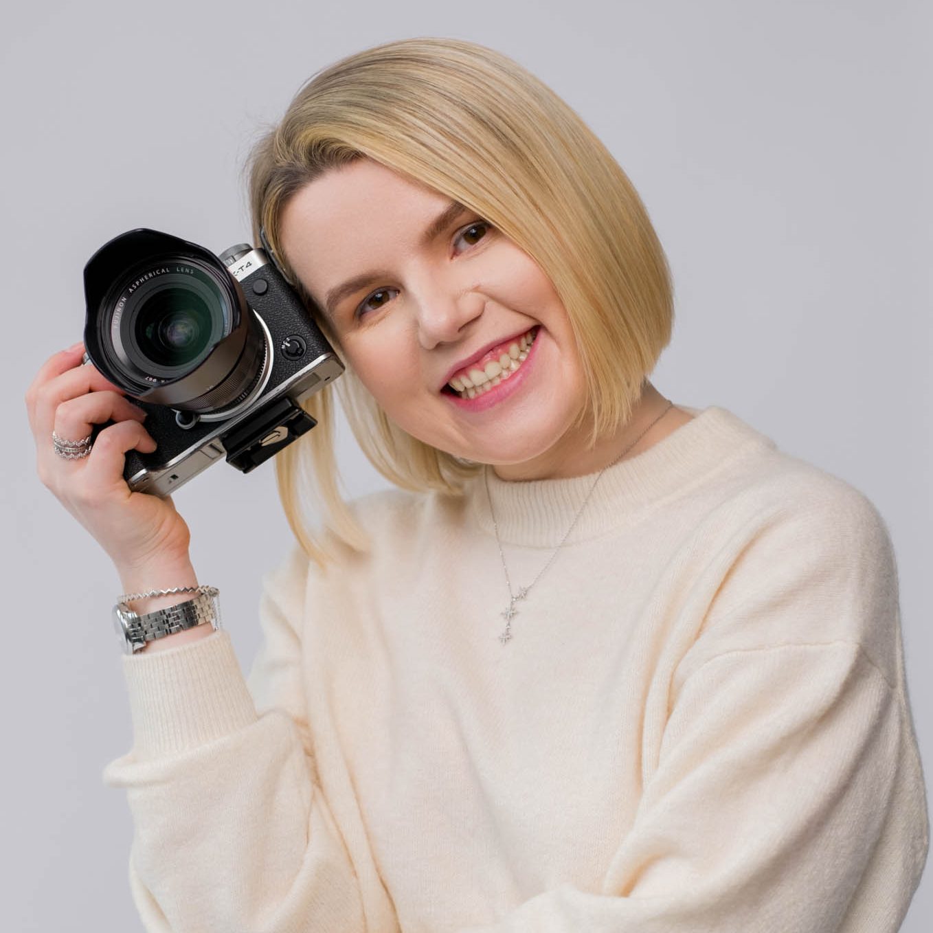business headshot of a professional female photographer smiling