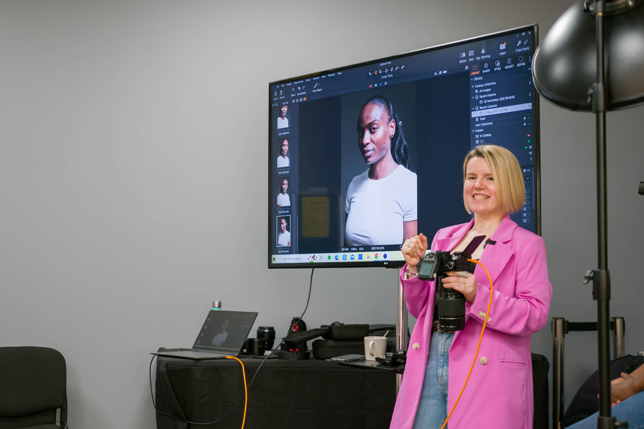 a professional photographer presenting lighting techniques in portraiture