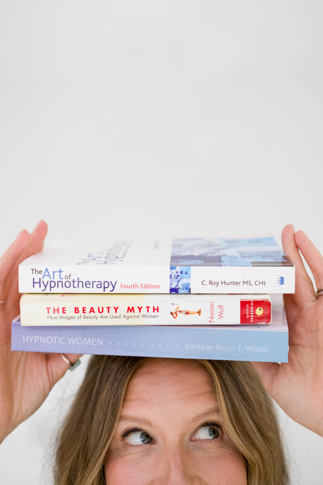 Branding photoshoot with a hypnotherapist. Detail photo of her book recommendations